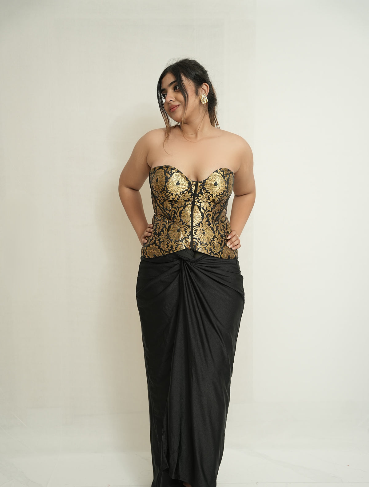 She became the moment | Gold and black brocade corset and drape skirt set.