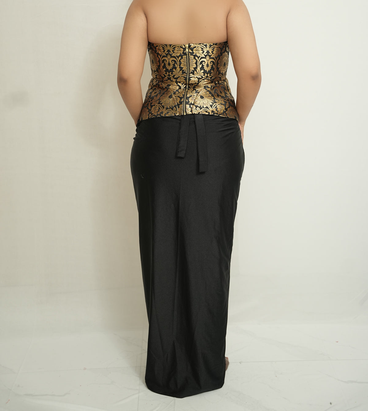 She became the moment | Gold and black brocade corset and drape skirt set.